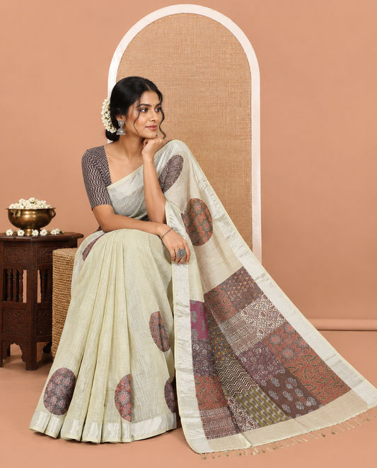Pista Green Linen Cotton Saree Features Ajrakh Geometric Print, a Zari Border, Printed Pallu, Contrast Blouse