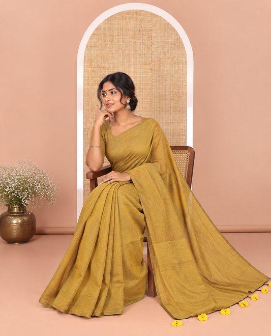 Borderless Mustard Plain Khadi Mul Cotton Saree Featuring a Self Pallu with Tassels, Paired with a Matching Plain Blouse