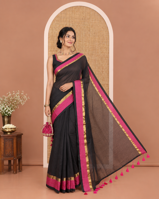 Black Plain Khadi Mul Cotton Saree, Complemented by a Contrast Pink Zari Border, Plain Pallu, and Paired with a Matching Blouse