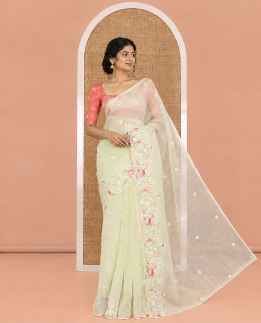 Pista Green Kota Doria Saree, Delicately Woven with Floral and Deer Embroidery, a Scallop Border, and a Contrast Deer Embroidery Blouse