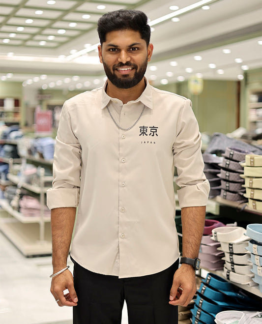 Cream Cotton-Blended Casual Shirt Features Typographic Print, Full-Sleeves, a Spread Collar, a Regular Fit, and a Regular Length