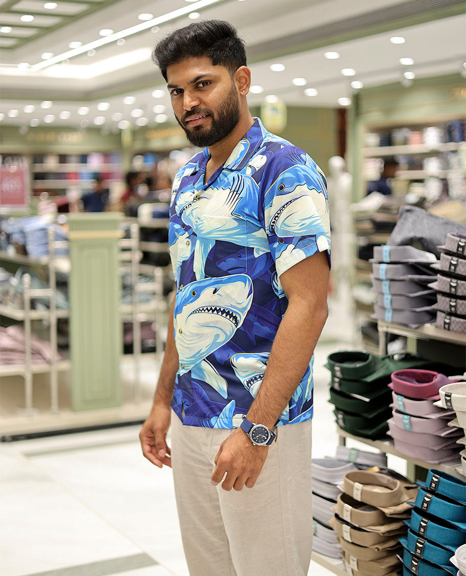 Multi-Color Poly-Blended Casual Shirt Features Pool of Sharks Print, Half Sleeves, a Poly Collar, a Regular Fit, and a Regular Length