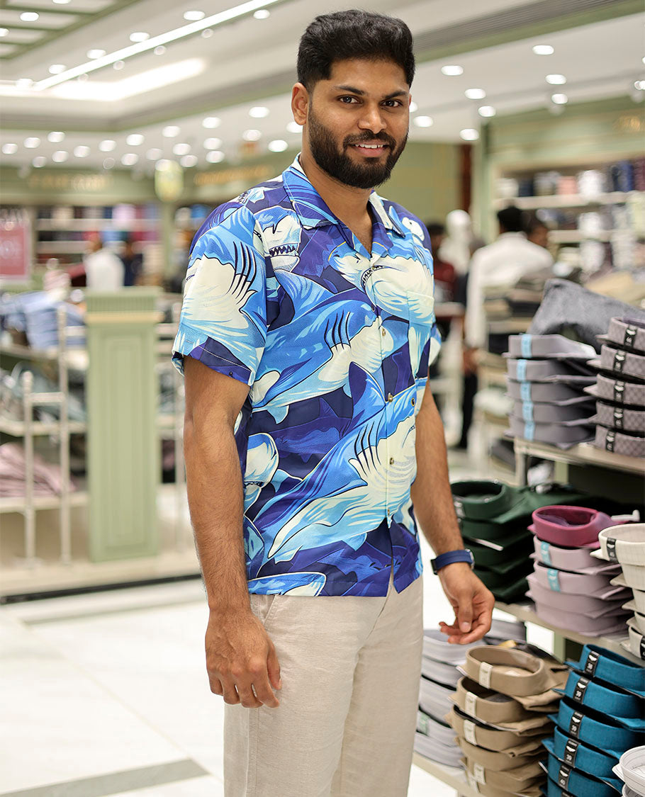 Multi-Color Poly-Blended Casual Shirt Features Pool of Sharks Print, Half Sleeves, a Poly Collar, a Regular Fit, and a Regular Length