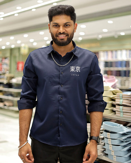 Navy Cotton-Blended Casual Shirt Features Typographic Print, Full-Sleeves, a Spread Collar, a Regular Fit, and a Regular Length