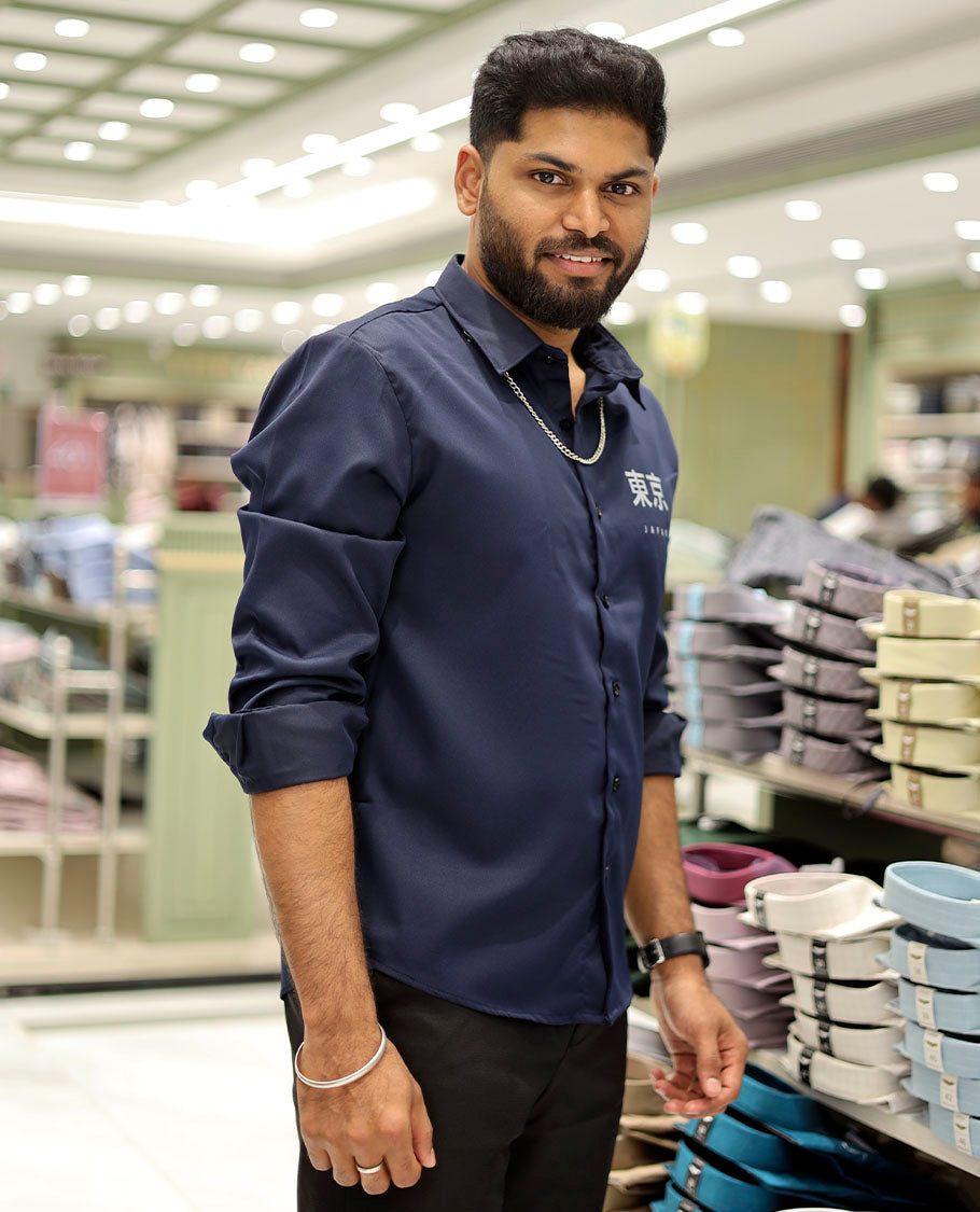 Navy Cotton-Blended Casual Shirt Features Typographic Print, Full-Sleeves, a Spread Collar, a Regular Fit, and a Regular Length