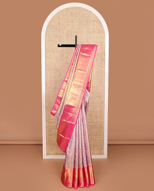 Gleaming lavender zari jacquard Kanchipuram tissue silk saree, contrast border of thilakam, kathir, muthu, kaddu kamalam, and Mughal-style floral bouquets, and jaal pallu