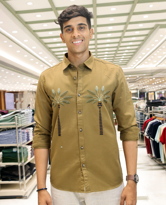 Coffee Brown Cotton-Blended Casual Shirt, Artfully Designed with Palm Tree Motifs Embroidery, Featuring a Spread Collar, Full Sleeves, Slim Fit, and Regular Length
