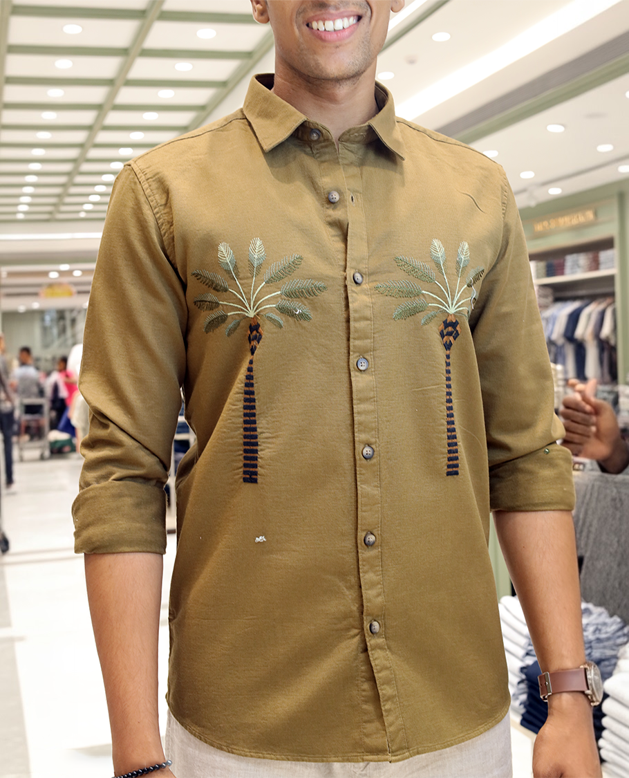 Coffee Brown Cotton-Blended Casual Shirt, Artfully Designed with Palm Tree Motifs Embroidery, Featuring a Spread Collar, Full Sleeves, Slim Fit, and Regular Length