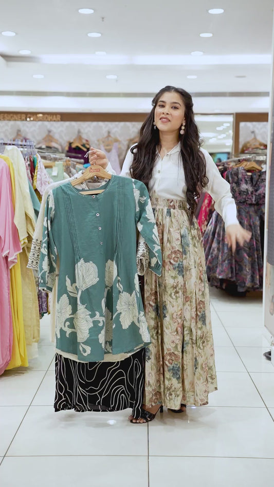 Green unique design round neck , 3/4 th sleeve , below knee lenght kurti with straight pants