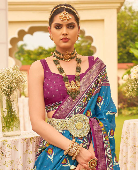 Blue patola floral motifs printed designer saree, contrast intricate patola border, and floral motifs patola printed pallu