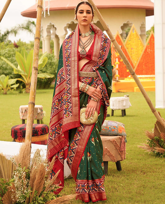 Green patola floral motifs printed designer saree, contrast intricate patola border, and floral motifs patola printed pallu