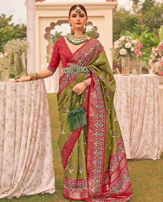 Green patola floral motifs printed designer saree, contrast intricate patola border, and floral motifs patola printed pallu