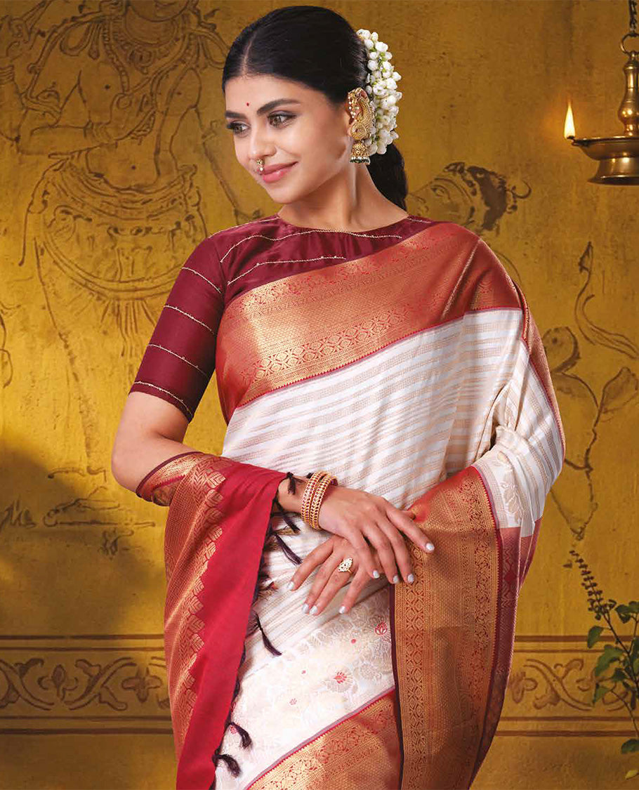 Half-white jacquard with floral meenakari design kanchipuram wedding silk saree, contrast border of thilakam, kodi visiry, laddu kamalam, and then kuli kann designs, and jaal pallu