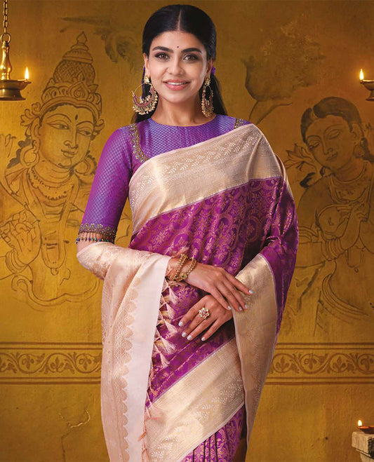 Magenta jacquard Kanchipuram wedding silk saree, contrast traditional zari border of leaf vine designs, and jaal pallu