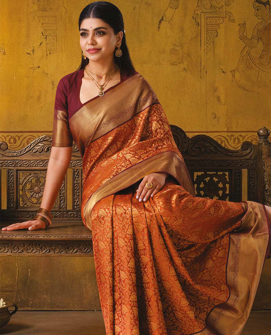 Rust floral jacquard kanchipuram wedding silk saree, contrast traditional zari design border, and intricate pallu