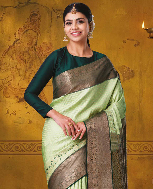 Pista green jacquard kanchipuram wedding silk saree, contrast traditional zari design border, and zari-rich jaal pallu